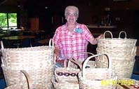 Betty Curry came from Missouri with 10,000 of her incomparable white oak
baskets and left with minus ten!
