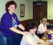 The most popular PERSON in town:  Lisa Boyes, a massage therpaist kneading Karen Wheeler's aching shoulders.
