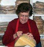 The lovely Miss Ann fills in the blanks in her handsome brown ash basket. 