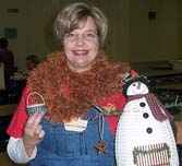 Montina looks GOOD holding the fruits of her labors in Helen Hatley's and Susan Reed-Fanfoni's classes at Country Weavers 2004.