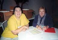 Juanita Carreon and Mary Zeh Kuhr staff the T Shirt desk
